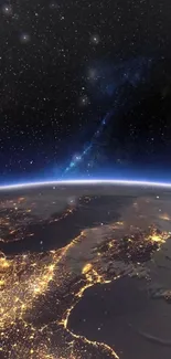 Earth from space with city lights and starry background.