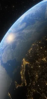 Stunning wallpaper of Earth from space with glowing city lights.