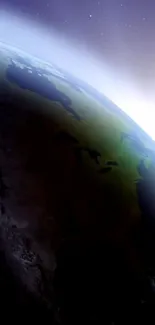 View of Earth with glowing horizon from space, showcasing stunning celestial beauty.