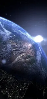View of Earth from space with sunlight highlighting the planet's surface.