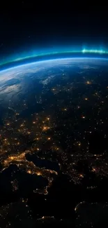 Stunning view of Earth from space with illuminated cities and glowing atmosphere.