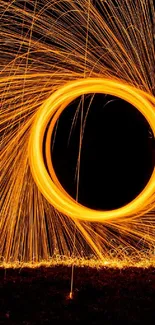 Dynamic firework circle with orange sparks against a dark background.