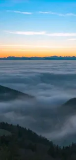 Foggy mountains with sunrise and clouds.