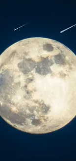 Close-up of a bright full moon against a dark blue night sky.