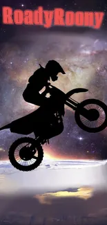 Motocross rider silhouette with galaxy backdrop.