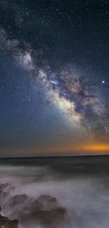 Breathtaking galaxy view over ocean at night with vibrant stars.