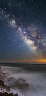 Galaxy night sky over ocean waves creating a serene and cosmic ambiance.