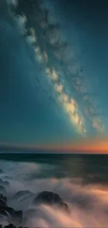 Mobile wallpaper of a galaxy over an ocean horizon with vibrant evening colors.