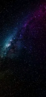 Vibrant galaxy wallpaper with stars and colorful nebulae for mobile screens.