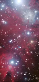 Vibrant red galaxy stars and nebula wallpaper for mobile screen.