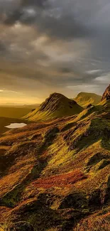 Golden mountain landscape at sunrise with dramatic skies.