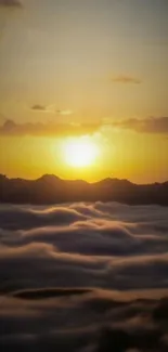 Golden sunrise over mountains and clouds.