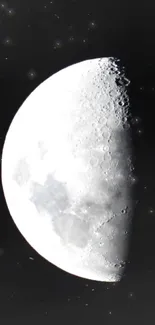 Luminous half moon against a dark sky, perfect for a mobile wallpaper.