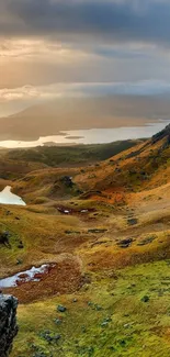 Golden brown highland landscape with lakes at sunrise.