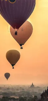 Hot air balloons float over temples at sunset, creating a serene and adventurous panorama.