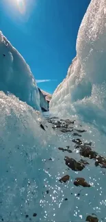 Breathtaking ice canyon with blue sky and glistening ice formations.