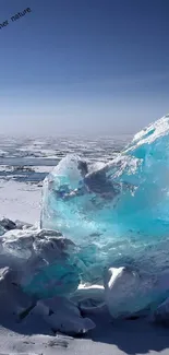 Stunning blue ice formations on a snowy landscape under a clear sky.