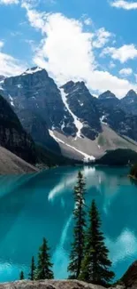 Breathtaking view of a turquoise lake bordered by majestic mountains and pine trees.