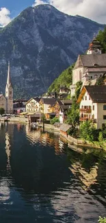 Picturesque town by mountain lake with scenic view.