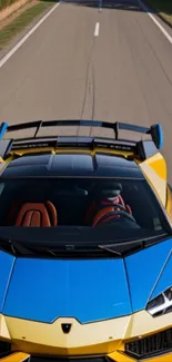 Lamborghini driving on an open road with vibrant colors in the background.