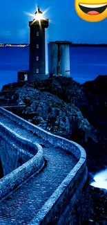 Lighthouse at night with glowing tower and ocean backdrop.