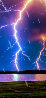 Violet lightning bolts over a tranquil lake at night.