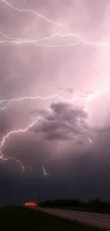 Dramatic lightning illuminates a dark stormy sky at night.