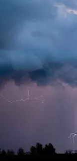 Dramatic lightning storm under a dark navy blue sky.