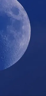 High-resolution wallpaper featuring a close-up of the moon in a blue night sky.