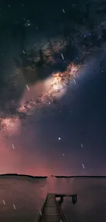 Milky Way galaxy over a serene lake and dock at night.