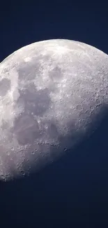 High-resolution mobile wallpaper of the moon with visible craters and a dark blue background.