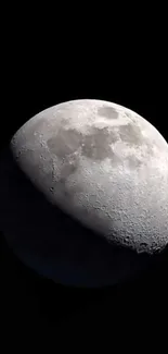 Realistic image of the moon against a black sky, showcasing detailed lunar surface.