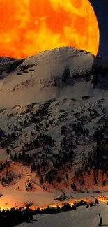 Glowing orange moon over a snowy mountain landscape at night.