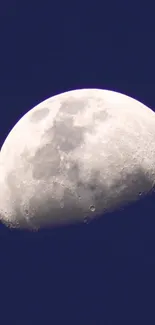 High-resolution crescent moon against a deep blue night sky.