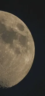 Close-up of the moon in a dark night sky, showcasing its craters and textures.