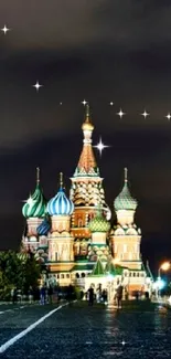 Night view of Saint Basil's Cathedral in Moscow with dark sky.