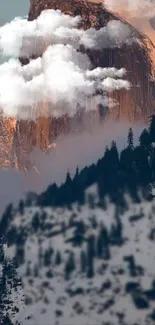 Mountain peak with clouds at sunset, creating a serene and beautiful view.