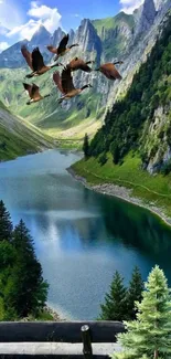 Scenic mountain lake with flying birds and lush greenery.