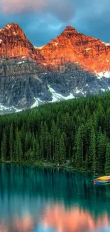 Serene lake with sunset reflecting on mountain landscape.