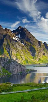 Stunning view of mountains reflected in a tranquil lake under a cloudy sky.