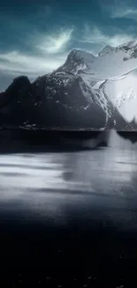 Snow-capped mountain and tranquil lake at twilight, creating a serene landscape.