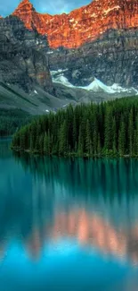 Serene mountain lake at sunset with vibrant colors reflecting on water.