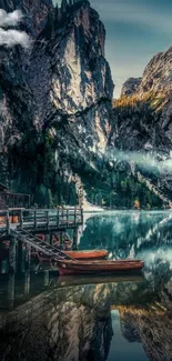 Mountain lake view with wooden dock and clear reflections at sunrise.