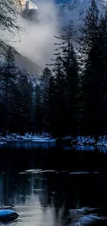 Mountain lake with snowy peaks and forest in serene setting.