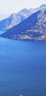 Beautiful mountain landscape with lake and blue sky.