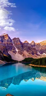 Scenic mountain lake at dawn with vibrant colors and reflections.