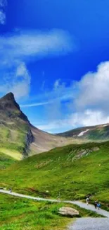 Blue sky and green mountain landscape wallpaper.