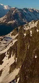 Majestic mountains with snow and clear blue sky.