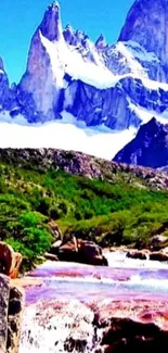 Majestic mountain landscape with snowy peaks and green valley scene.