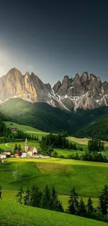 Lush green valley with majestic mountains under a blue sky.